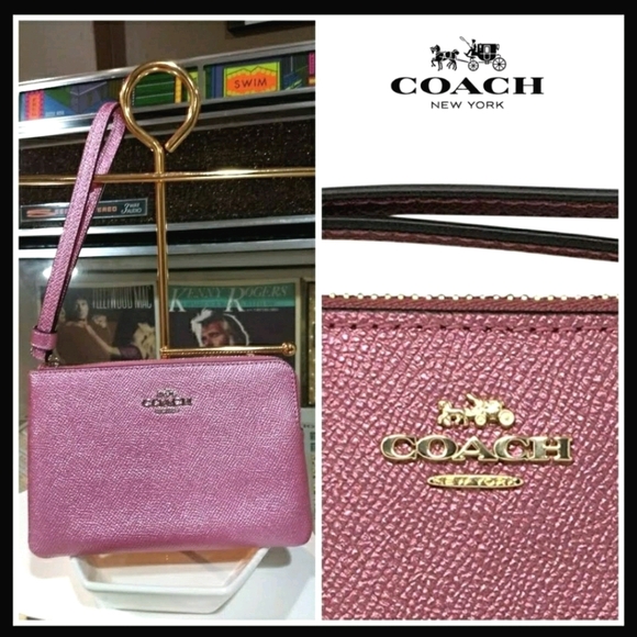 Coach Handbags - NWT Pink Metallic Coach Wristlet